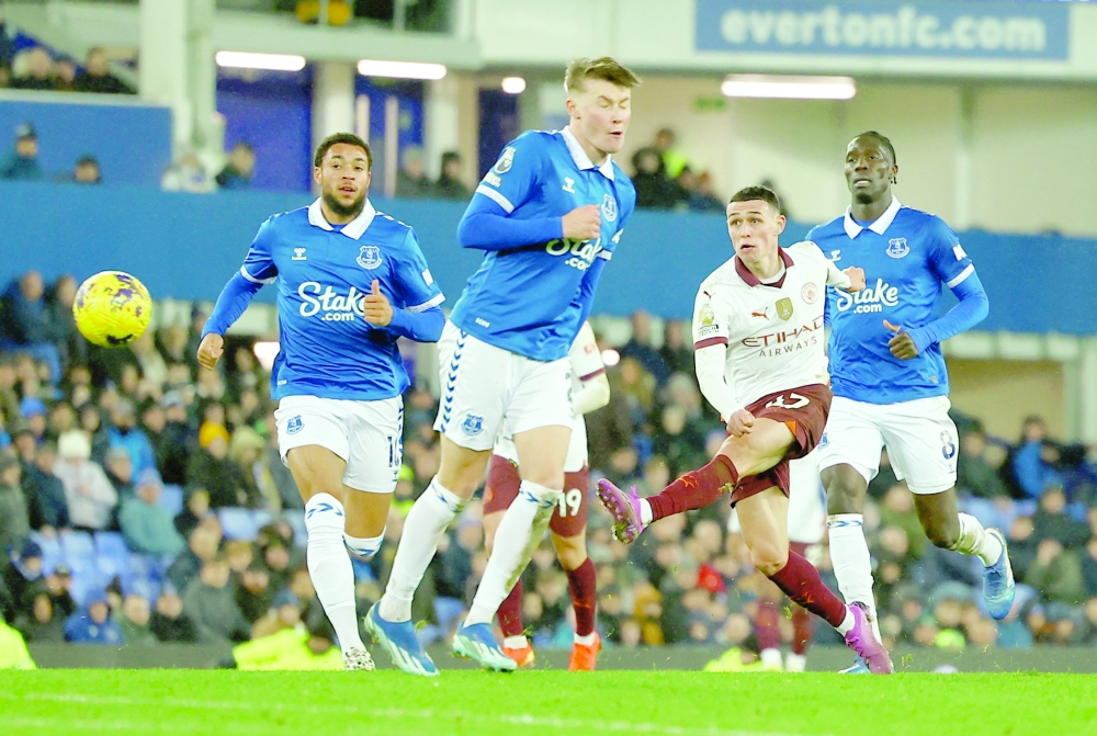 Soccer Football - Premier League - Everton v Manchester City - Goodison Park, Liverpool, Britain - December 27, 2023 Manchester City's Phil Foden shoots at goal REUTERS