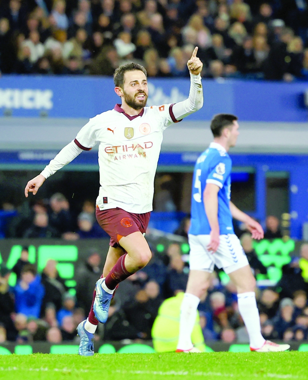 Soccer Football - Premier League - Everton v Manchester City - Goodison Park, Liverpool, Britain - December 27, 2023 Manchester City's Bernardo Silva celebrates scoring their third goal REUTERS