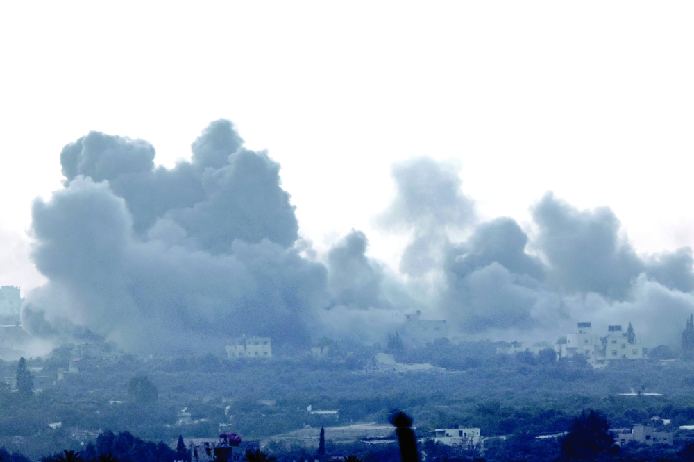 A picture shows smoke billowing over northern Gaza during Israeli bombardment. — AFP 