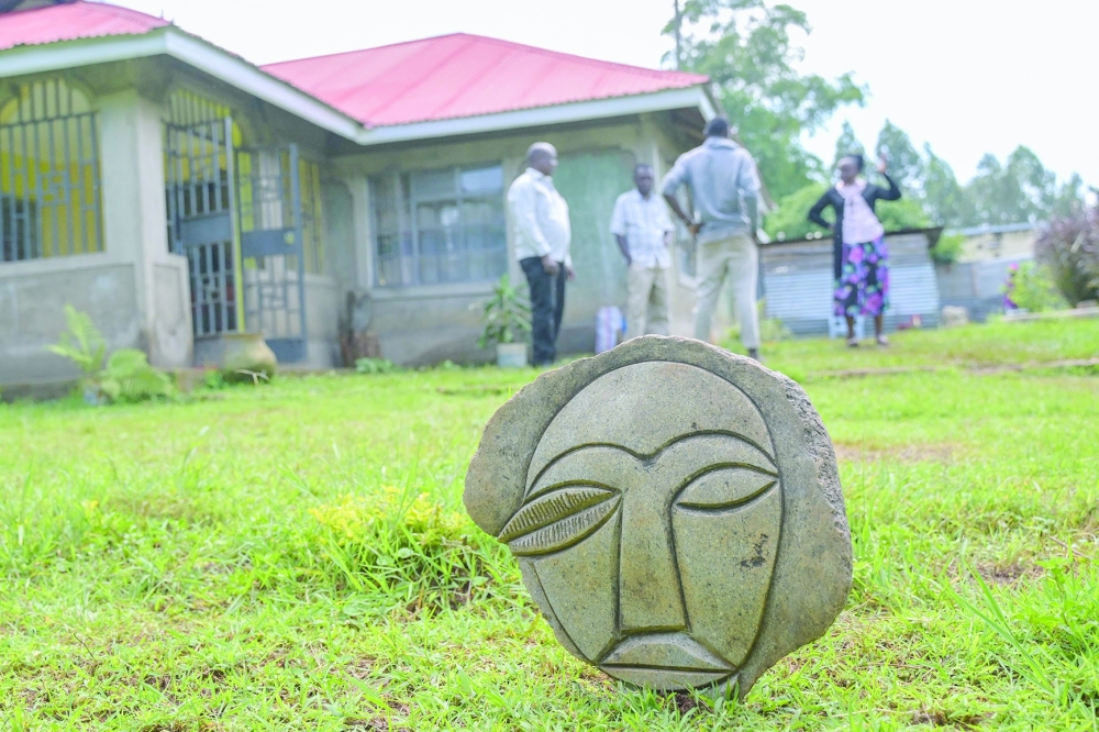 A stone sculpture is seen outside the home of Kenyan sculptor Elkana Ong'esa in Tabaka near Kisii. - AFP