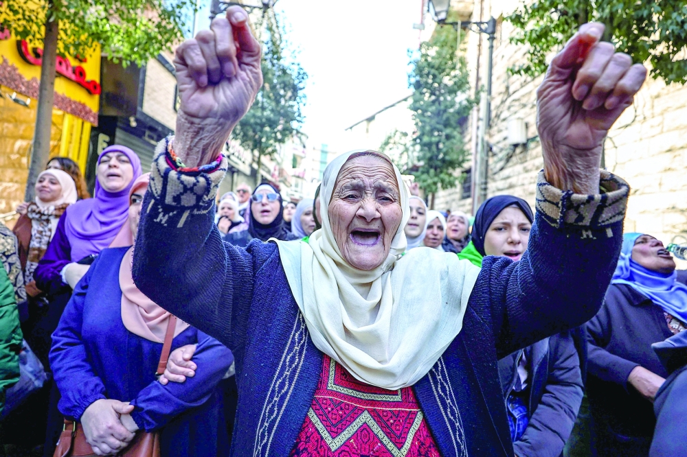 Palestinian demonstrators shout slogans during a rally in support of the Gaza Strip after the Friday noon prayer in Ramallah in the occupied West Bank. - AFP