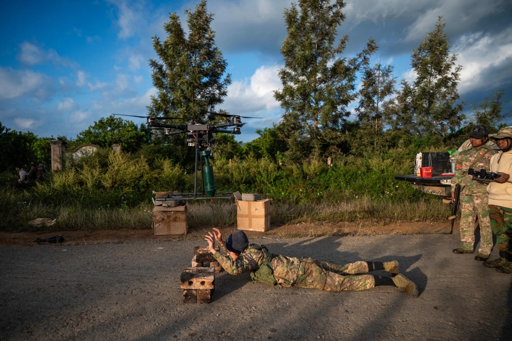 This photo shows members of the Mandalay People Defense Forces (MDY-PDF) releasing a drone near the frontline amid clashes with Myanmar's military in northern Shan State. — AFP file photo 