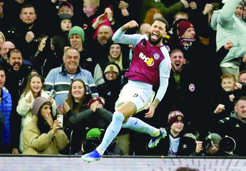Aston Villa's Douglas Luiz celebrates scoring their third goal. — REUTERS