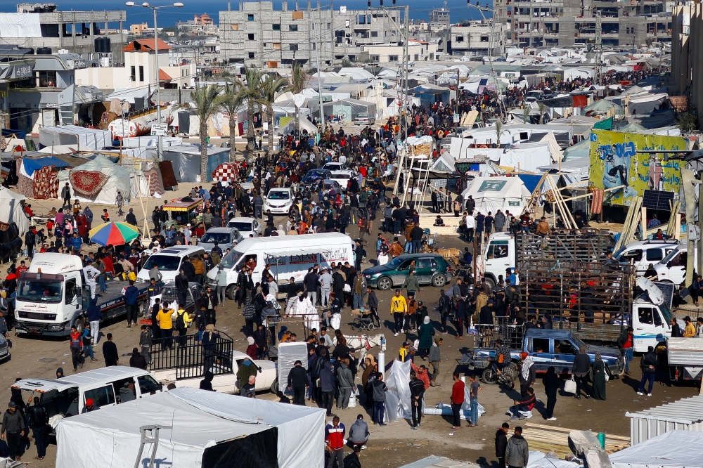 Displaced Palestinians, who fled their homes due to Israeli strikes, shelter in a tent camp, in Rafah. — Reuters 