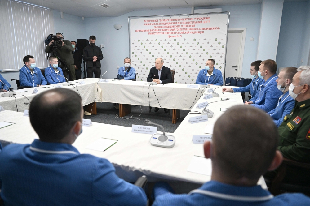 Russia's President Vladimir Putin meets with servicemen wounded in Ukraine while visiting the Central Vishnevsky Military Clinic in Moscow. — AFP 