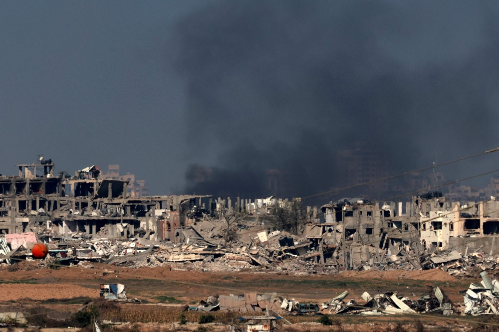 This picture shows smoke billowing over Gaza City following Israeli strikes. — AFP 