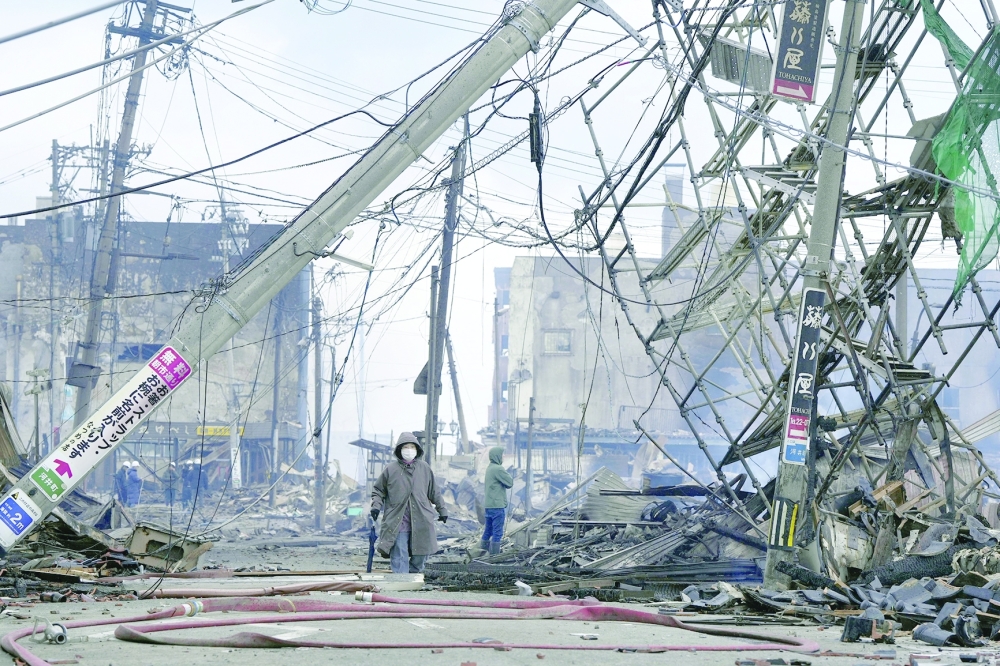 A burnt-down residential and commercial area site following an earthquake is seen in Wajima