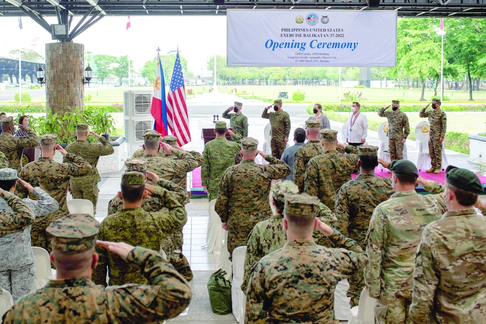 Philippine and US soldiers salute while national anthems are being played, during the opening ceremony of Balikatan joint military exercise, at Camp Aguinaldo in Quezon City, Metro Manila, Philippines. — Reuters file photo
