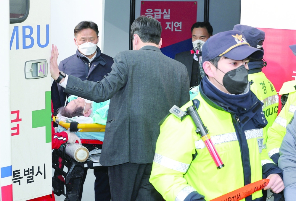 South Korea’s opposition Democratic Party leader Lee Jae-myung arrives on a stretcher at Seoul National University Hospital, in Seoul, South Korea. — Reuters