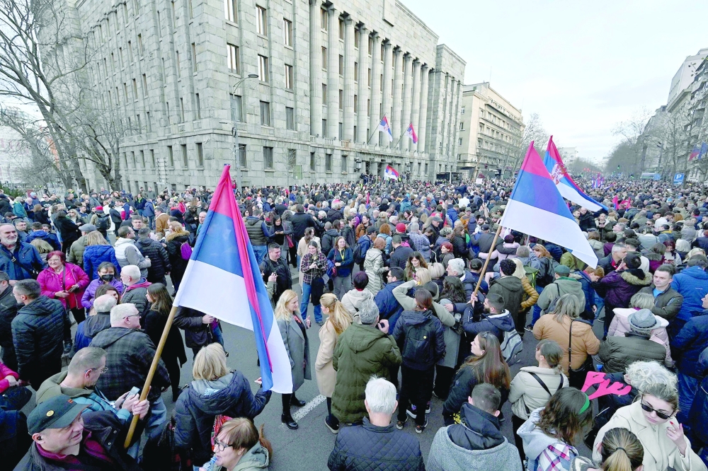 Several thousands of people wave Serbian flags as they attend a rally of “ProGlas”, a Serbian pro-democracy movement, to protest against alleged electoral fraud, in Belgrade, on December 30. — AFP file photo