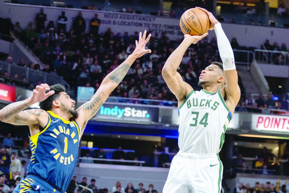 Indianapolis, Indiana, USA; Milwaukee Bucks forward Giannis Antetokounmpo (34) shoots the ball while Indiana Pacers forward Obi Toppin (1) defends in the second quarter at Gainbridge Fieldhouse. Mandatory Credit: Trevor Ruszkowski-USA TODAY Sports