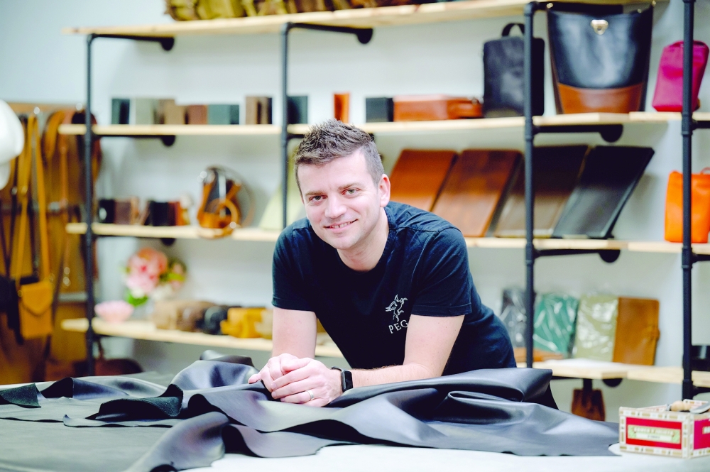 Volkan Yilmaz, known as Tanner Leatherstein, at Pegai, his leather store in Dallas. — NYT