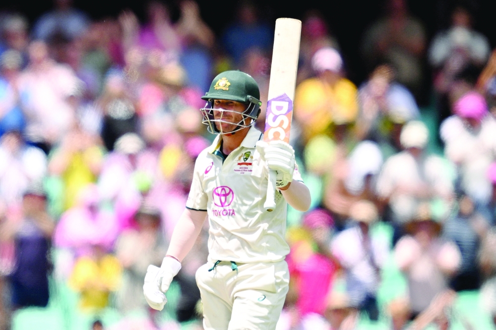Australia's David Warner celebrates his half century in his last test match.— REUTERS