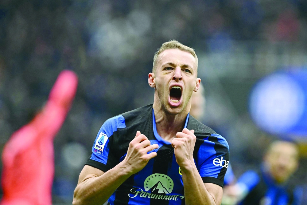 Inter Milan's Davide Frattesi celebrates after scoring his team's second goal. —  AFP