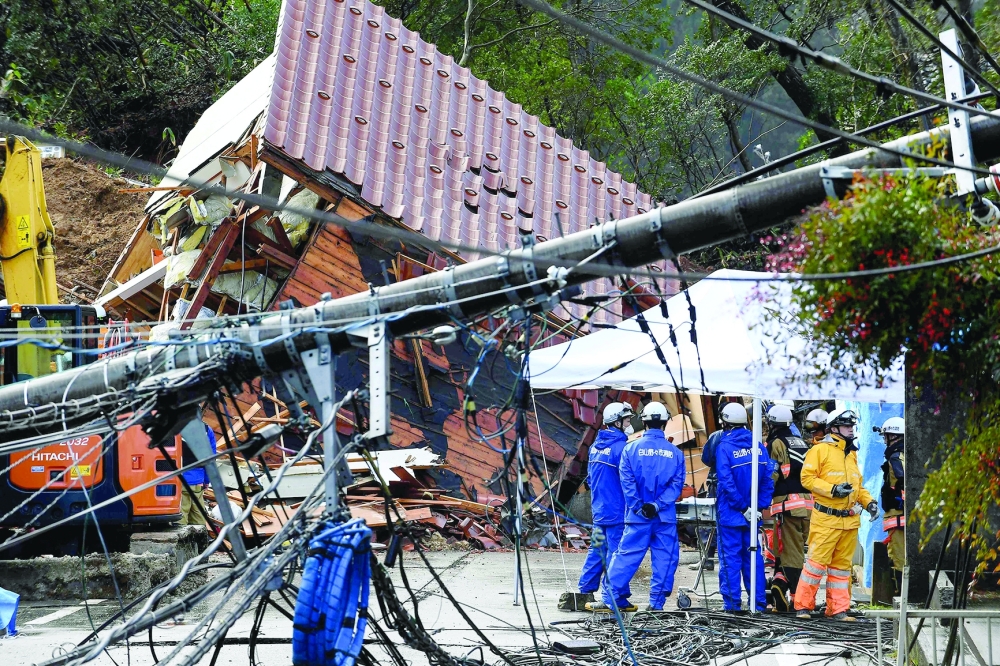Rescuers search for missing victims at a landslide site in the Kawashima district in the city of Anamizu, Ishikawa Prefecture. — AFP 