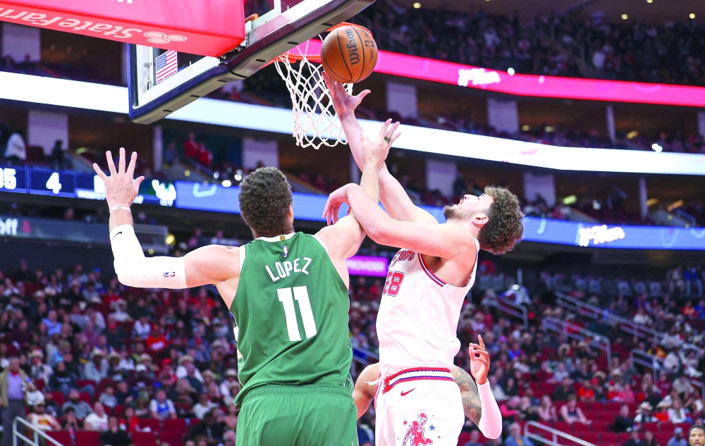 Alperen Sengun (28) attempts to get a rebound away from  Brook Lopez (11).— USA TODAY Sports
