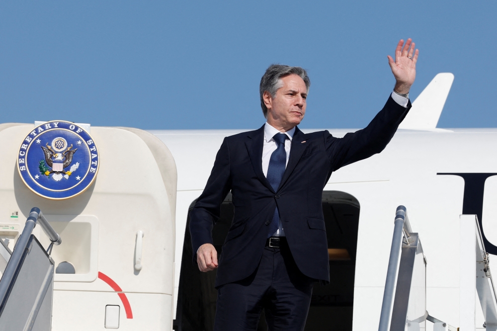 U.S. Secretary of State Antony Blinken waves as he departs for Saudi Arabia, during his week-long trip aimed at calming tensions across the Middle East, in Abu Dhabi, United Arab Emirates. — Reuters 