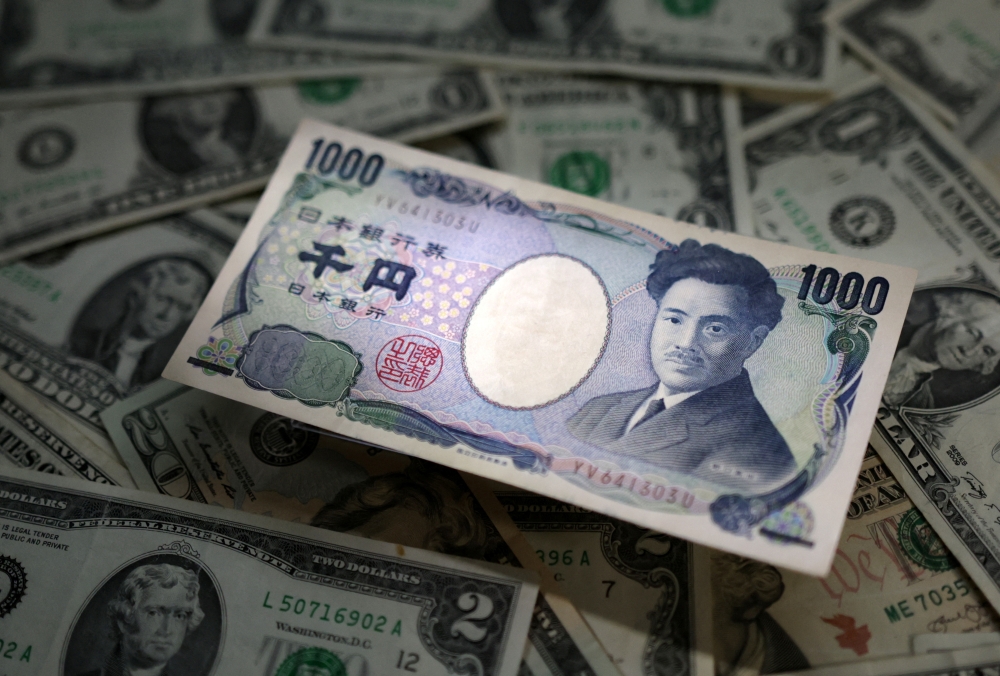 Illustration shows Japanese Yen and US dollar banknotes. — Reuters