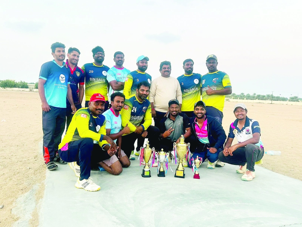 Bin Salim team players with their trophies.