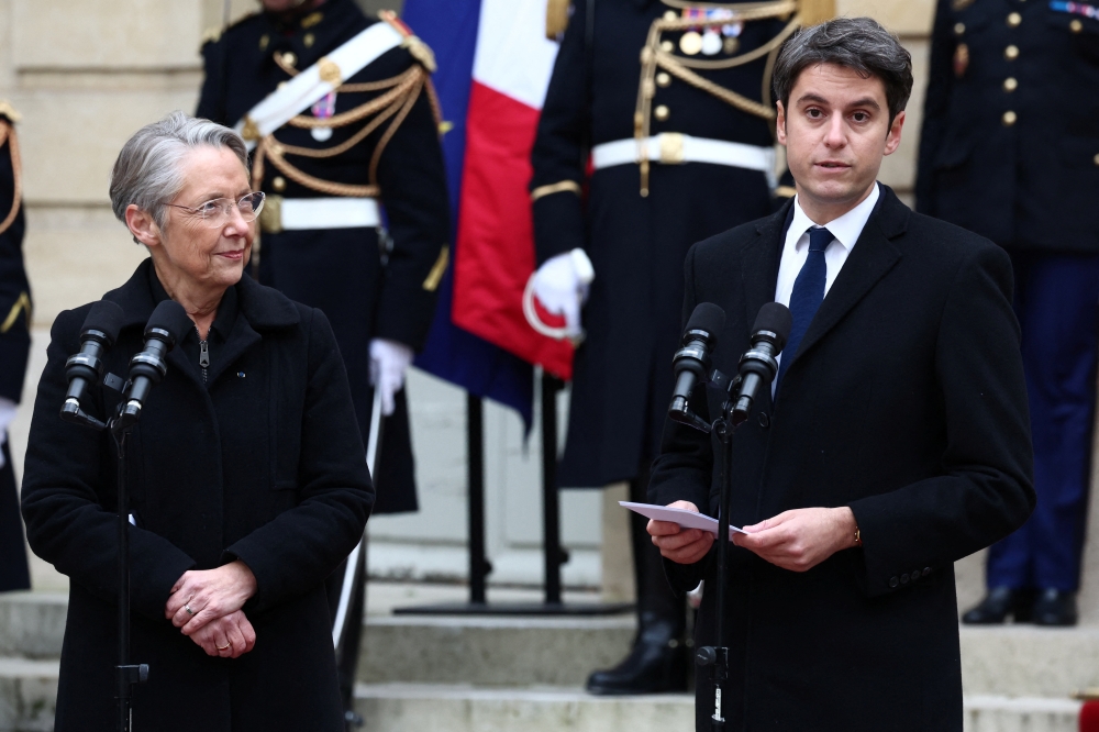 Newly-appointed French Prime Minister Gabriel Attal delivers a speech during a handover ceremony with outgoing French Prime Minister Elisabeth Borne in the courtyard of the Hotel Matignon, French Prime ministers' official residence, in Paris. — Reuters 