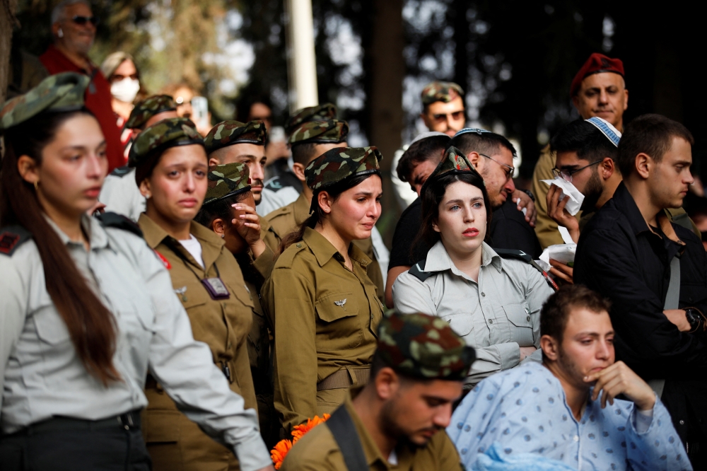 Soldiers attend the funeral of Israeli soldier Sergeant Roi Tal, who was killed in the southern Gaza Strip amid the ongoing ground operation of the Israeli army against Palestinian Islamist group Hamas, in Kfar Yehoshua, in northern Israel, January 9, 2024.