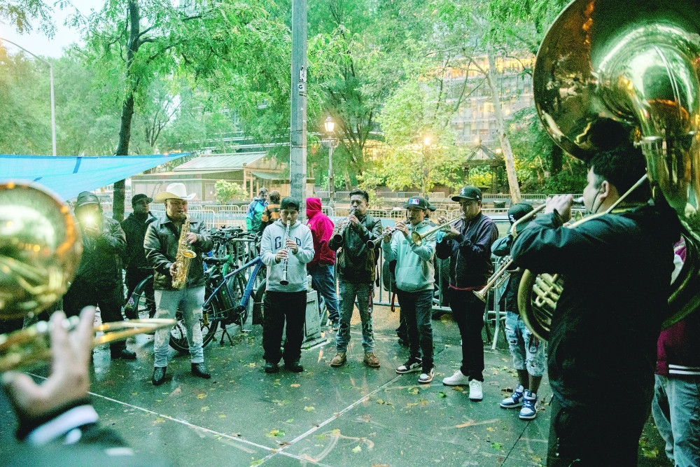 A band plays funereal music during a vigil for Félix Patricio Teófilo in Manhattan.