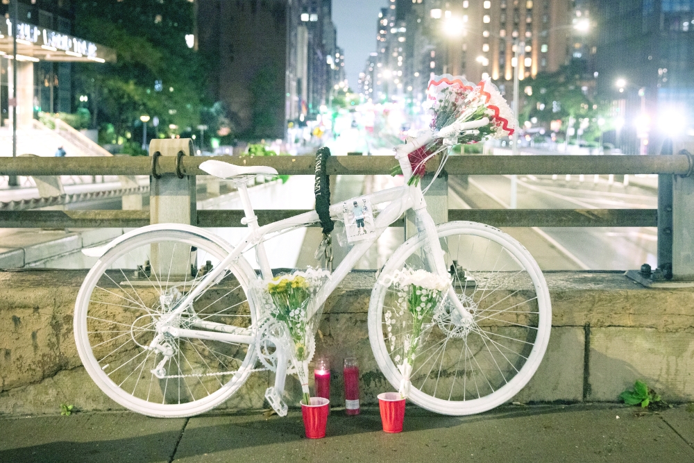 A bicycle painted white is used as a memorial for Félix Patricio Teófilo by 47th Street and First Avenue in Manhattan, near where he was killed.