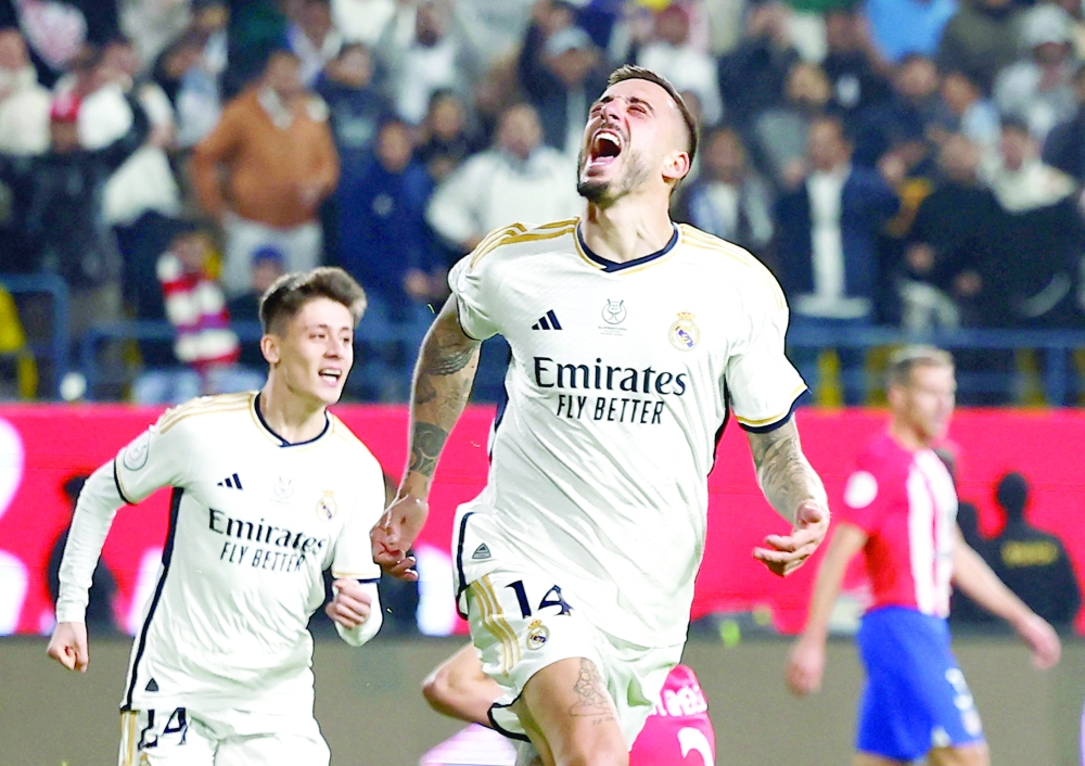 Real Madrid's Joselu celebrates after Atletico Madrid's Stefan Savic scores an own goal and Real Madrid fourth goal REUTERS