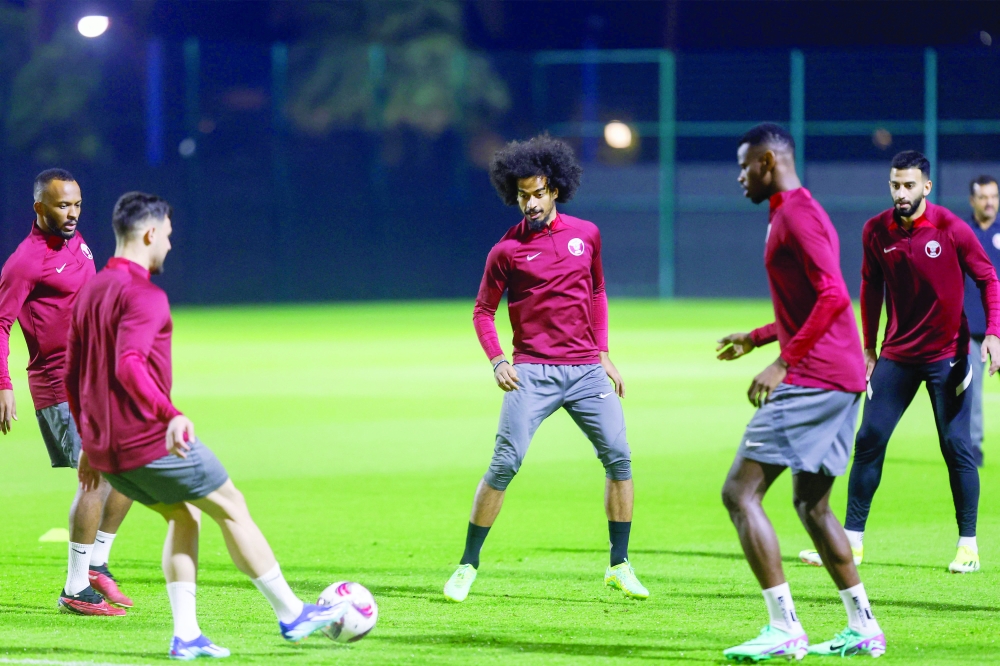 Qatar's players take part in a training at the Hilton Salwa Beach Resort and Villa in Abu Samrah in Qatar.