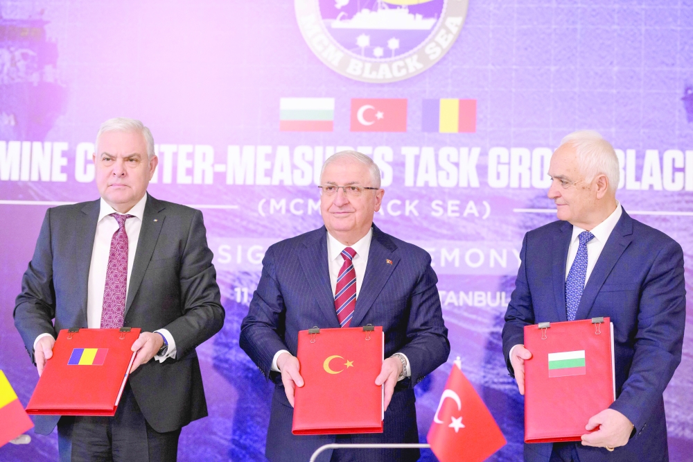 Turkish Defence Minister (C), Romanian Defense Minister & Bulgaria's Deputy Defence Minister(R) after signing an agreement on demining the Black Sea to ensure safe waters after Russia's war in Ukraine, in Istanbul. - AFP