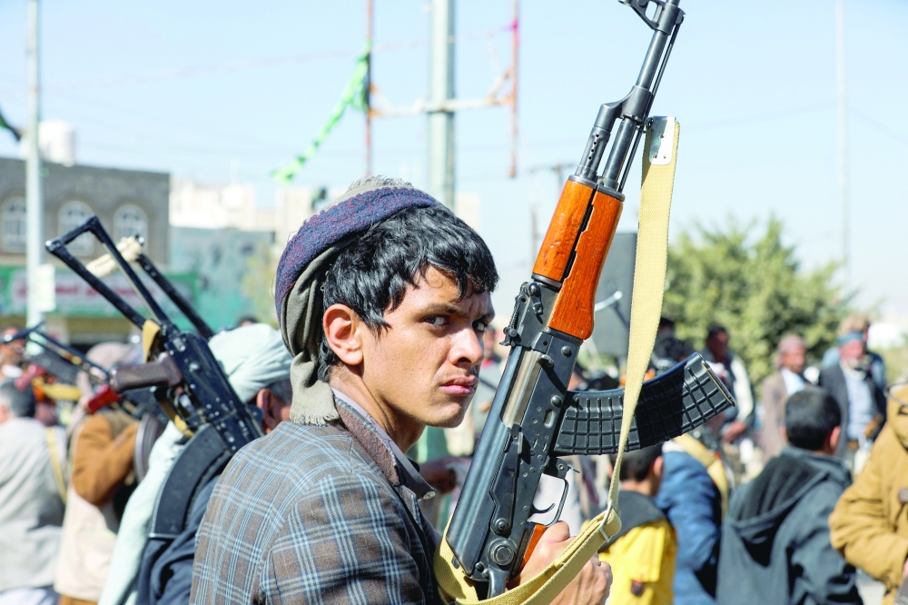 A newly recruited Ansar Allah fighter looks on during a ceremony at the end of his training in Sanaa on Thursday. — Reuters
