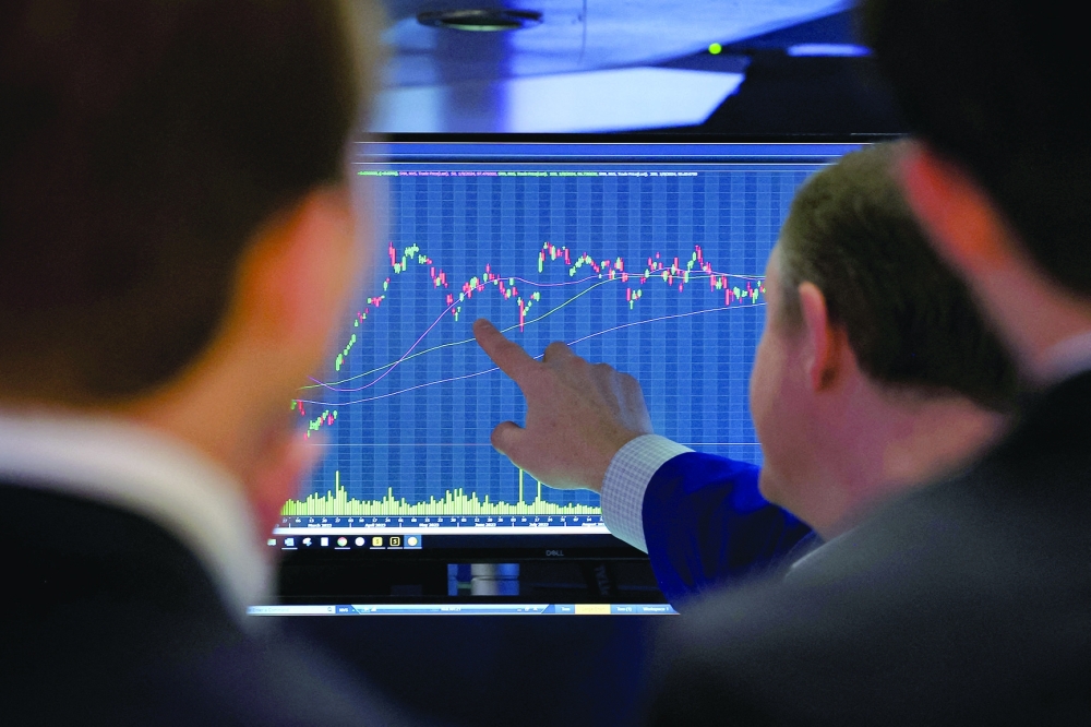 Traders work on the floor at the New York Stock Exchange (NYSE) in New York City.

