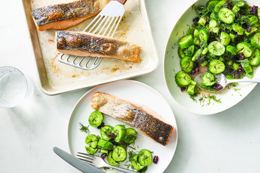 Roasted salmon with dill and cucumber salad. Food styled by Monica Pierini. NYT