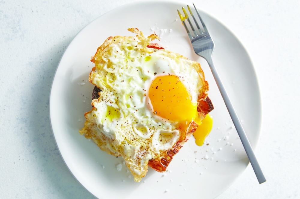 A fried egg on toast. Food styled by Simon Andrews. NYT
