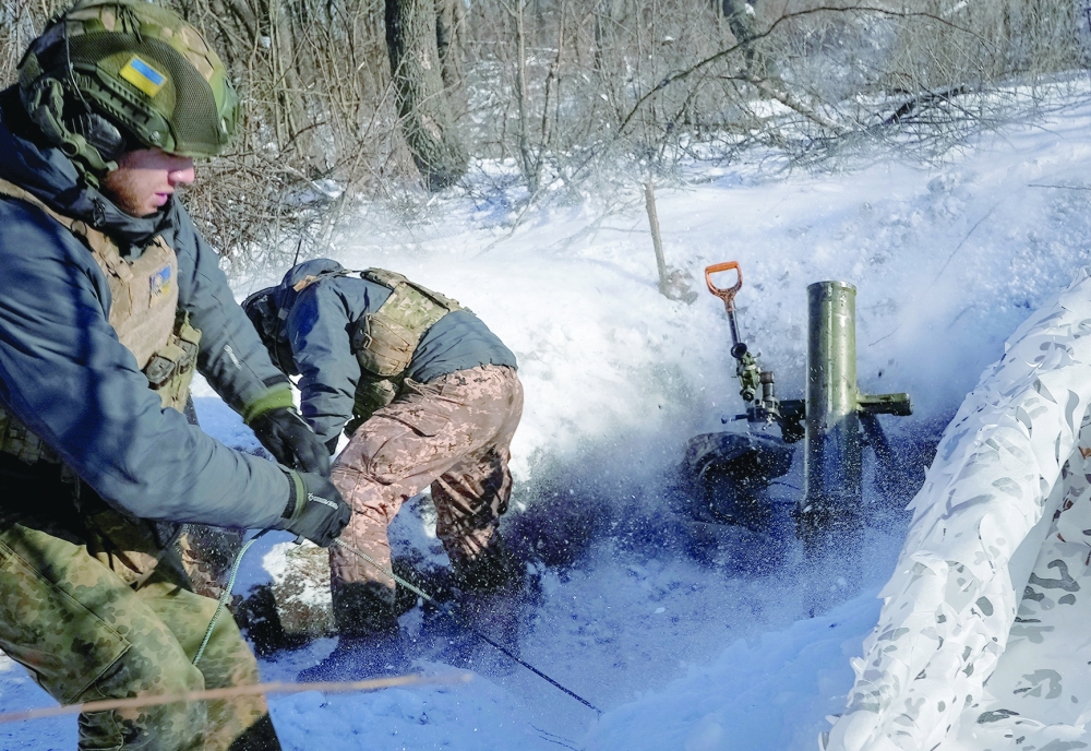 A Ukrainian serviceman of 2 battalion 92nd brigade fires a 120-mm mortar towards Russian troops, at a position near Bakhmut in Donetsk region, Ukraine. — Reuters
