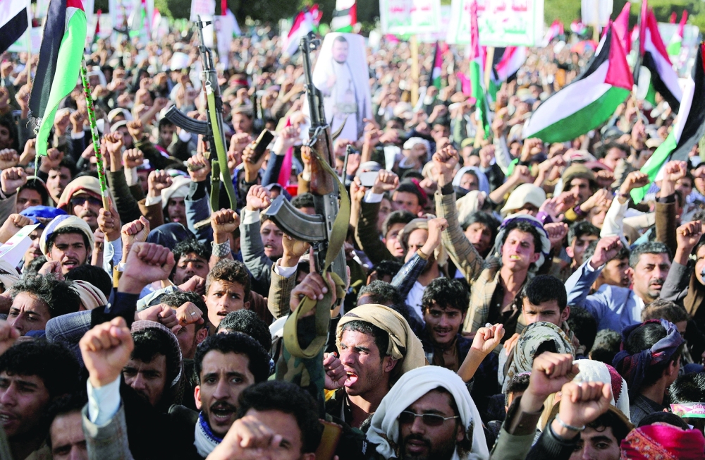 Yemenis rally to denounce air strikes launched by the U.S. and Britain, in Sanaa, Yemen. — Reuters 