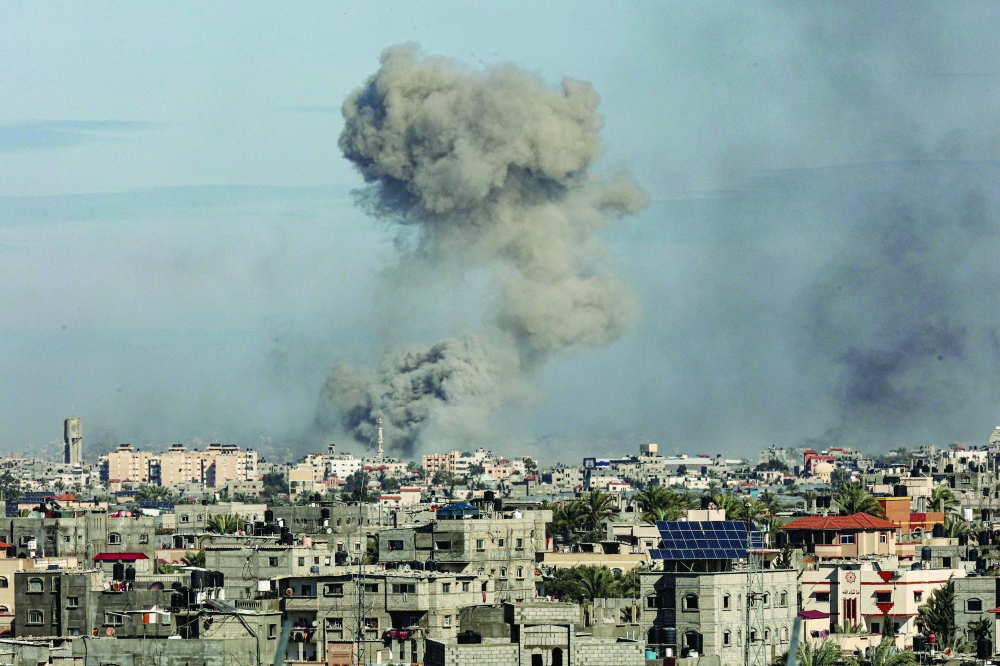 A picture shows smoke billowing over Khan Yunis in the southern Gaza Strip during Israeli bombardment. — AFP