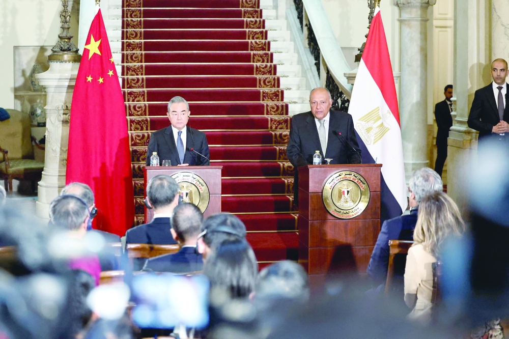 Egyptian Foreign Minister Sameh Shoukry (R) and China's Foreign Minister Wang Yi give a press conference following a meeting at Tahrir Palace in the centre of the Egyptian capital Cairo. — AFP
