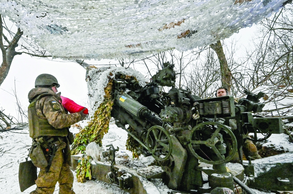Ukrainian servicemen prepare a M777 howitzer to fire toward Russian troops at a position near a front line, in Zaporizhzhia region, Ukraine. — Reuters 
