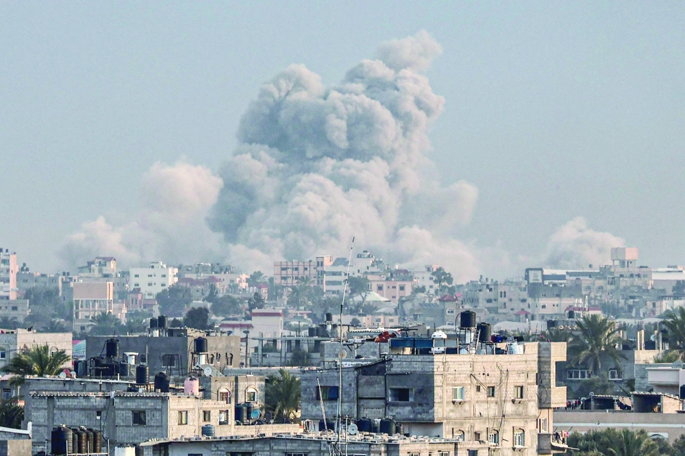 This photograph from Rafah shows smoke billowing over Khan Yunis in the southern Gaza Strip during Israeli bombardment. — AFP