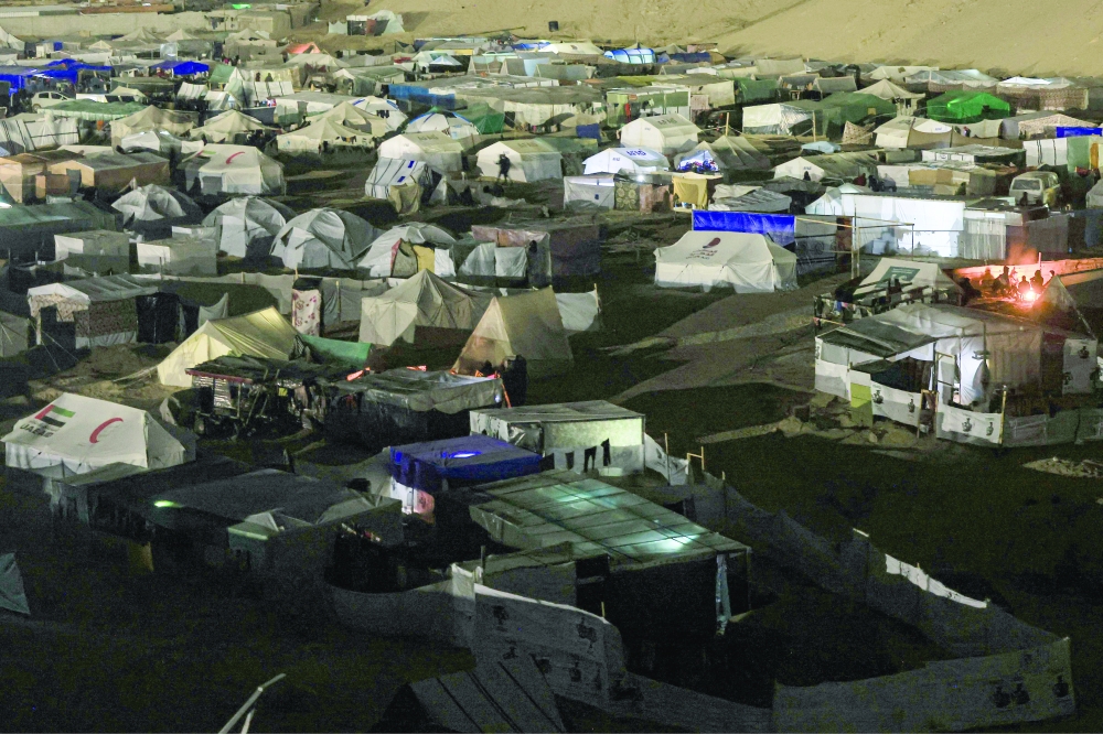 A picture shows a makeshift camp for displaced Palestinians west of Rafah who fled Israeli strikes. — AFP 