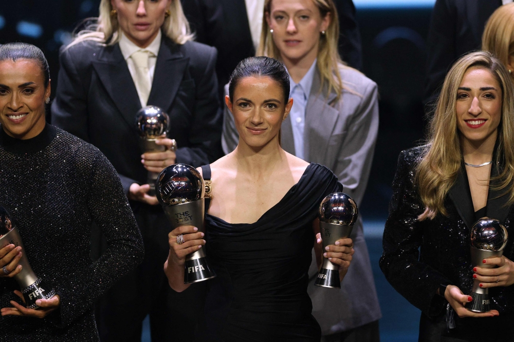 Spain and Barcelona midfielder Aitana Bonmati (C) poses with her awards