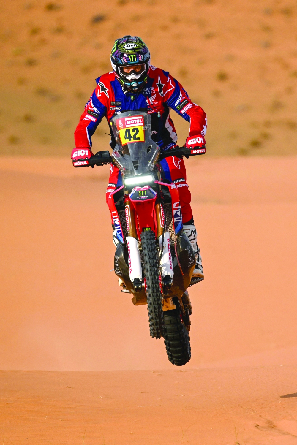 Monster Energy Honda Team's French biker Adrien Van Beveren competes in the dunes during stage 8 between Al Duwadimi and Hail on January 15, 2024, as part of the Dakar rally 2024. (Photo by PATRICK HERTZOG / AFP)