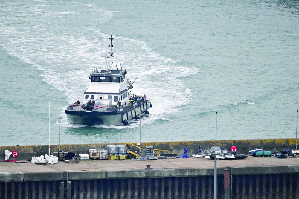 Dinghies are pictured on the quayside as UK Border Force vessel 'Defender', carrying migrants picked up at sea attempting to cross the English Channel from France, returns in Dover southeast England. — AFP