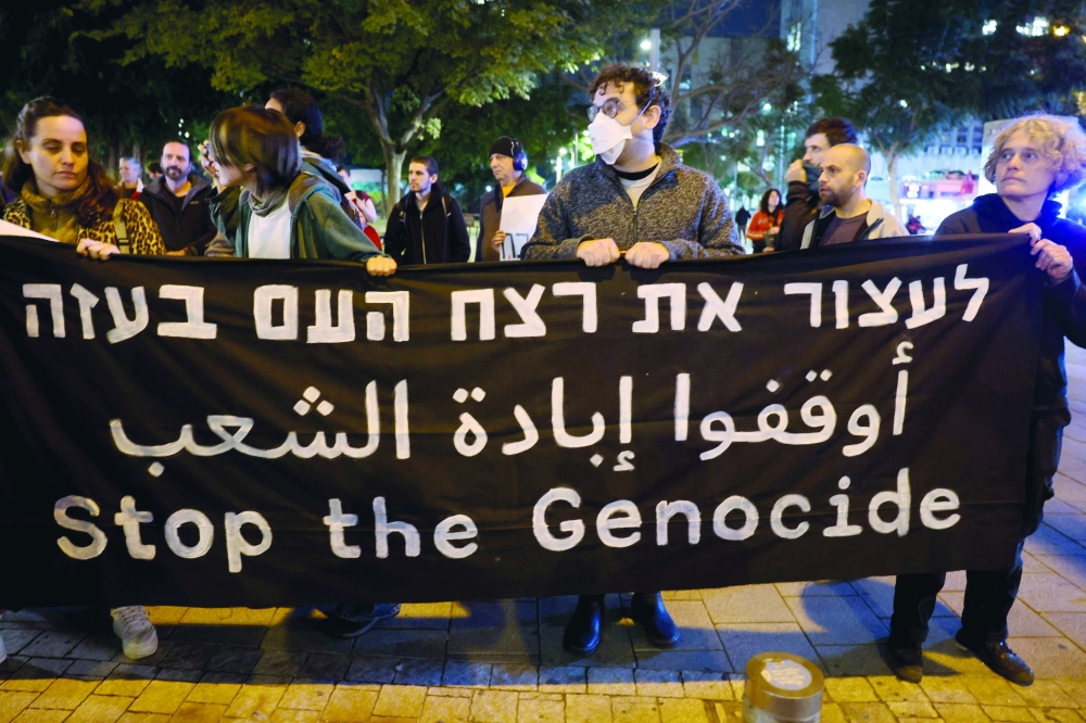 Israeli anti-war and anti-government demonstrators hold a rally in Tel Aviv. — AFP