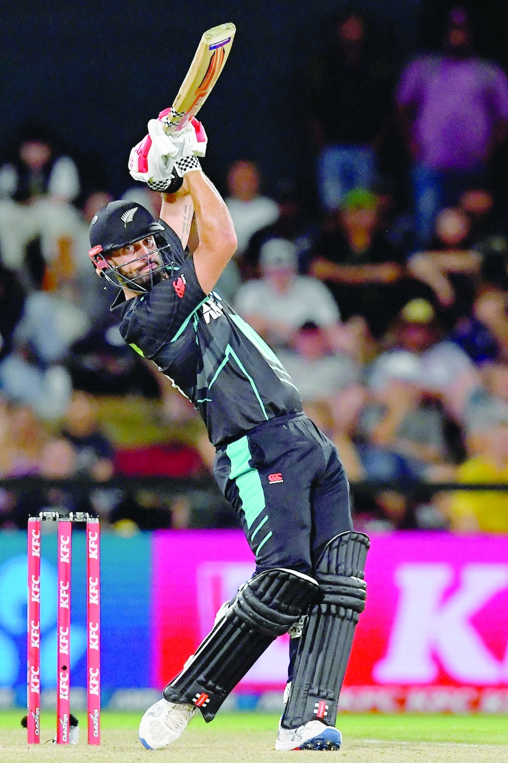 New Zealand's Daryl Mitchell looks on after playing a shot during the fourth Twenty20 international cricket match between New Zealand and Pakistan at Hagley Oval in Christchurch on January 19, 2024. (Photo by Sanka Vidanagama / AFP)

