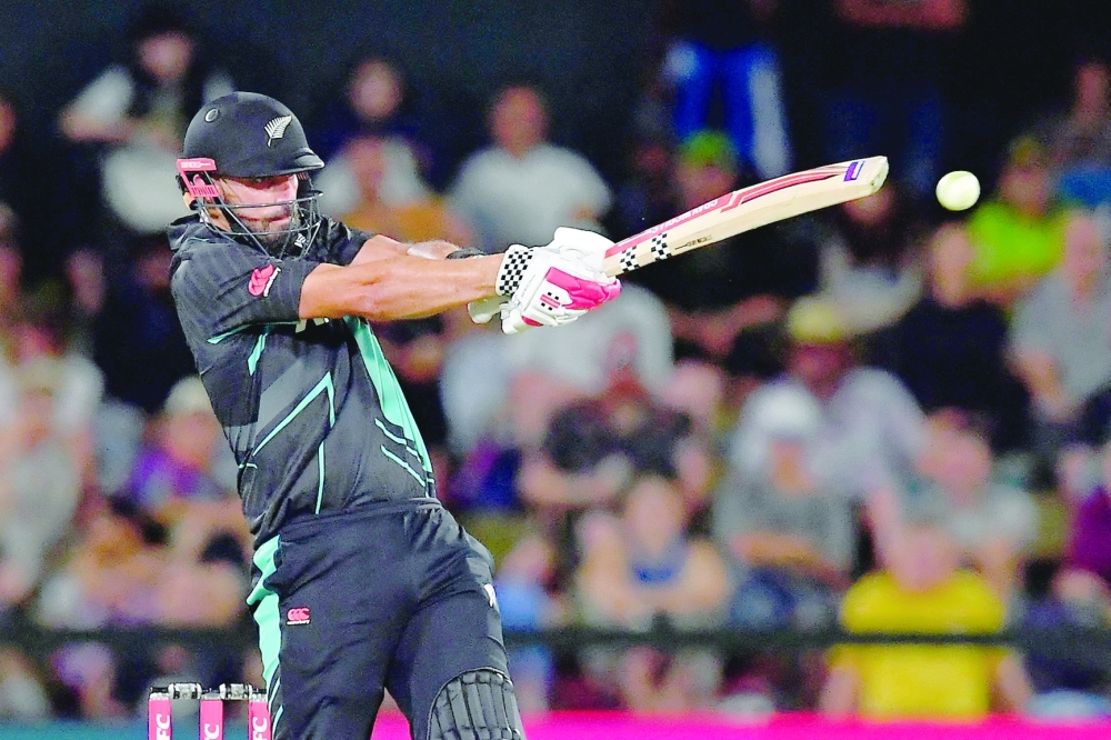 New Zealand's Daryl Mitchell plays a shot during the fourth Twenty20 international cricket match between New Zealand and Pakistan at Hagley Oval in Christchurch on January 19, 2024. (Photo by Sanka Vidanagama / AFP)

