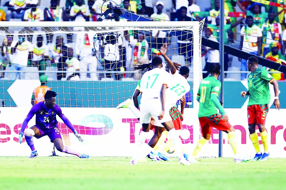 Senegal's forward #18 Ismaila Sarr shoots and scores his team's first goal during the Africa Cup of Nations (CAN) 2024 group C football match between Senegal and Cameroon at the Stade Charles Konan Banny in Yamoussoukro on January 19, 2024.