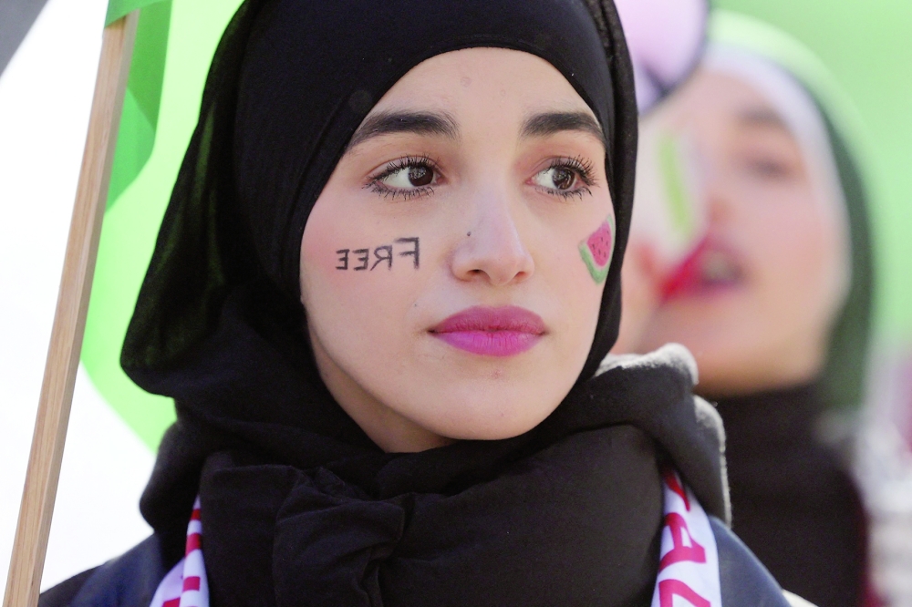 A woman takes part in a rally in Madrid on Saturday in support of the people of Gaza. - AFP