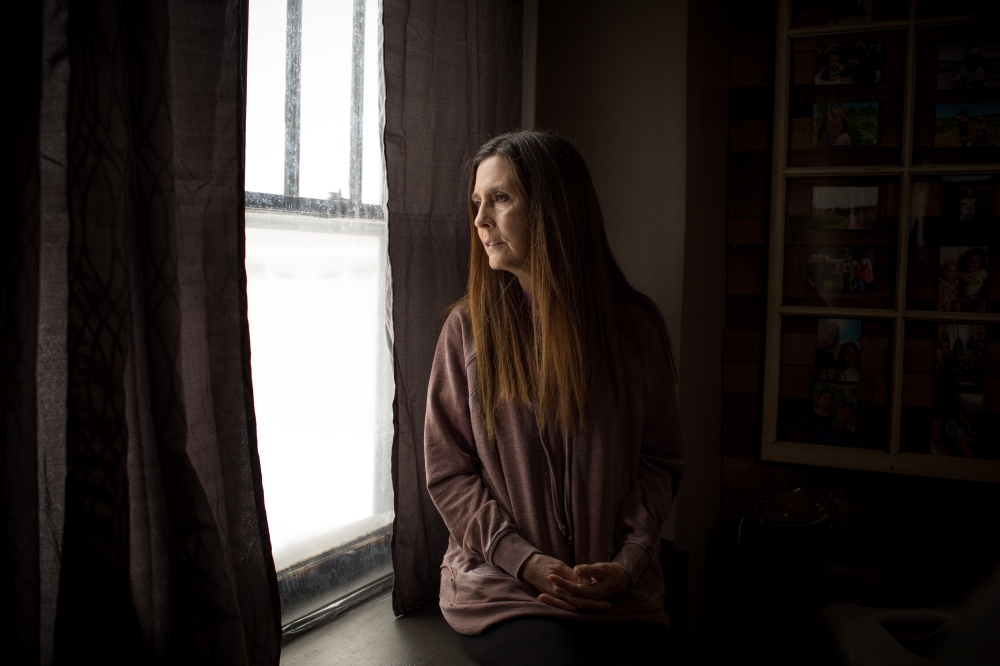 Cynthia Mosson, 61 and recovering from emergency open-heart surgery last year, at home in Frankfort, Ind., Jan. 19, 2024. (Kaiti Sullivan/The New York Times)